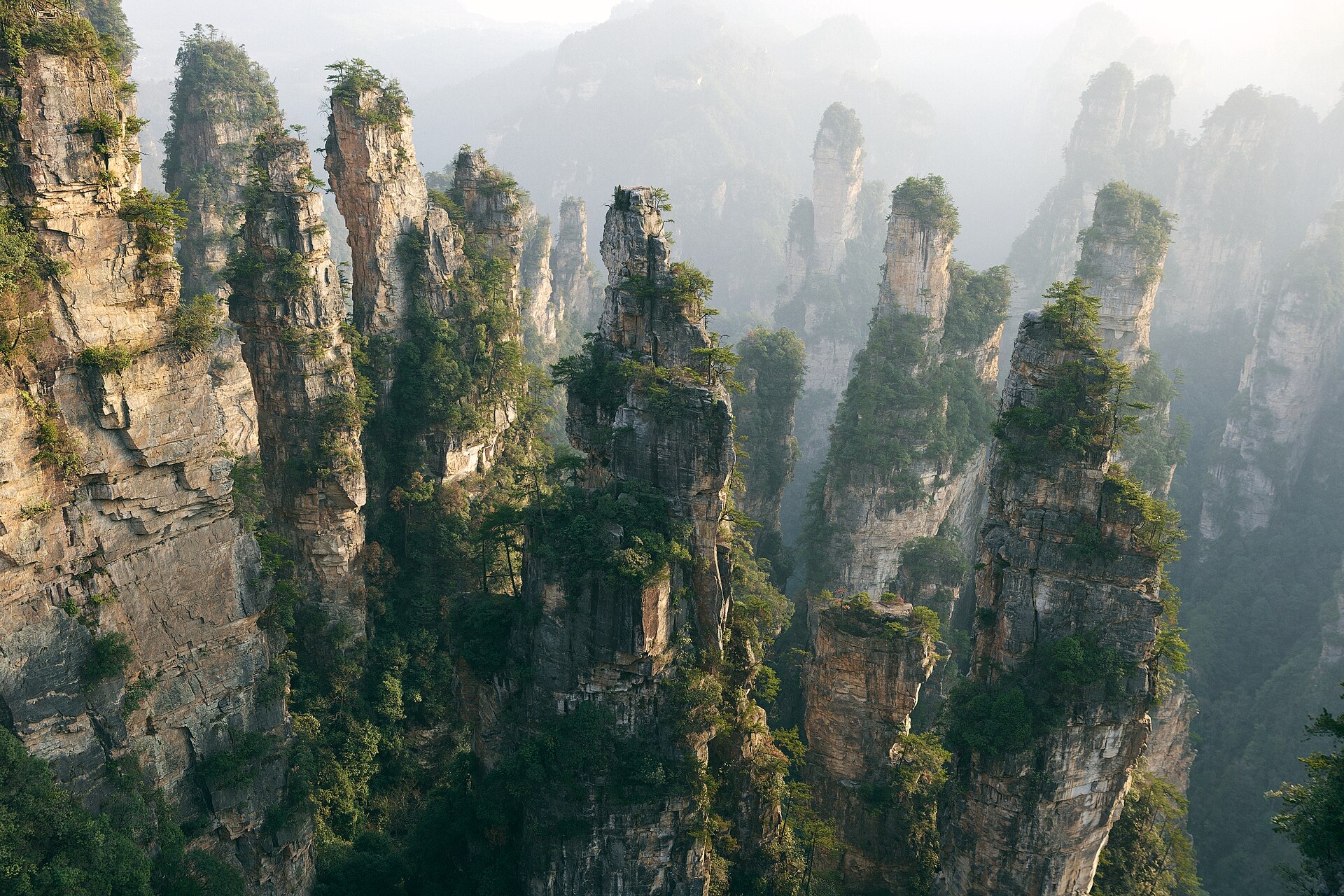 Sandstone pillars of Zhangjiajie National Forest Park rising out of the mist